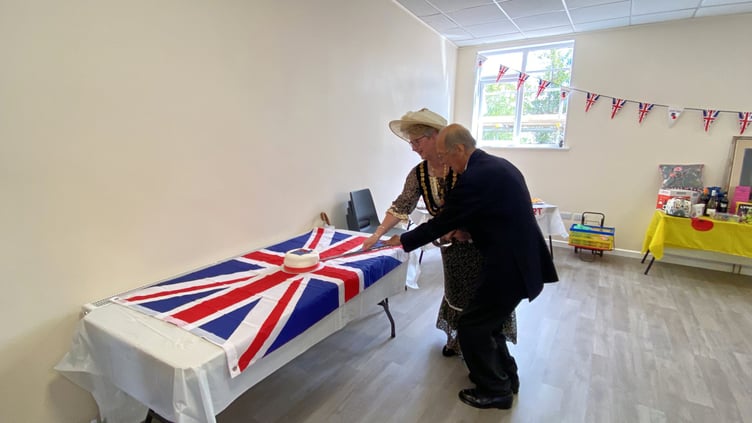 A special cake (inset) was commissioned for a ceremonial cake cutting performed by Launceston branch President John Knights and Mayor Cllr Helen Bailey