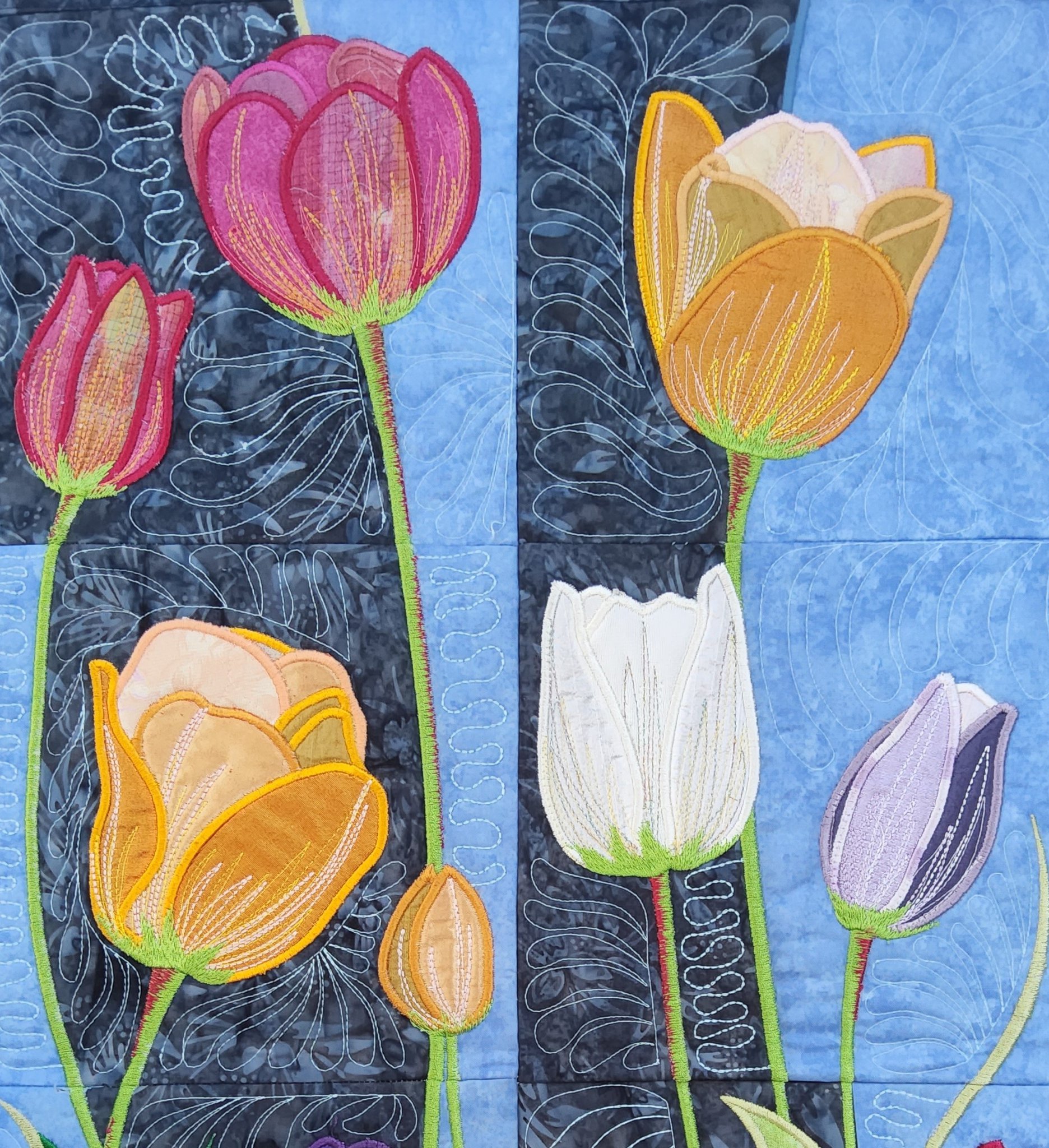 Tulips by Angela Teago – Detail of a machine embroidered applique hanging.