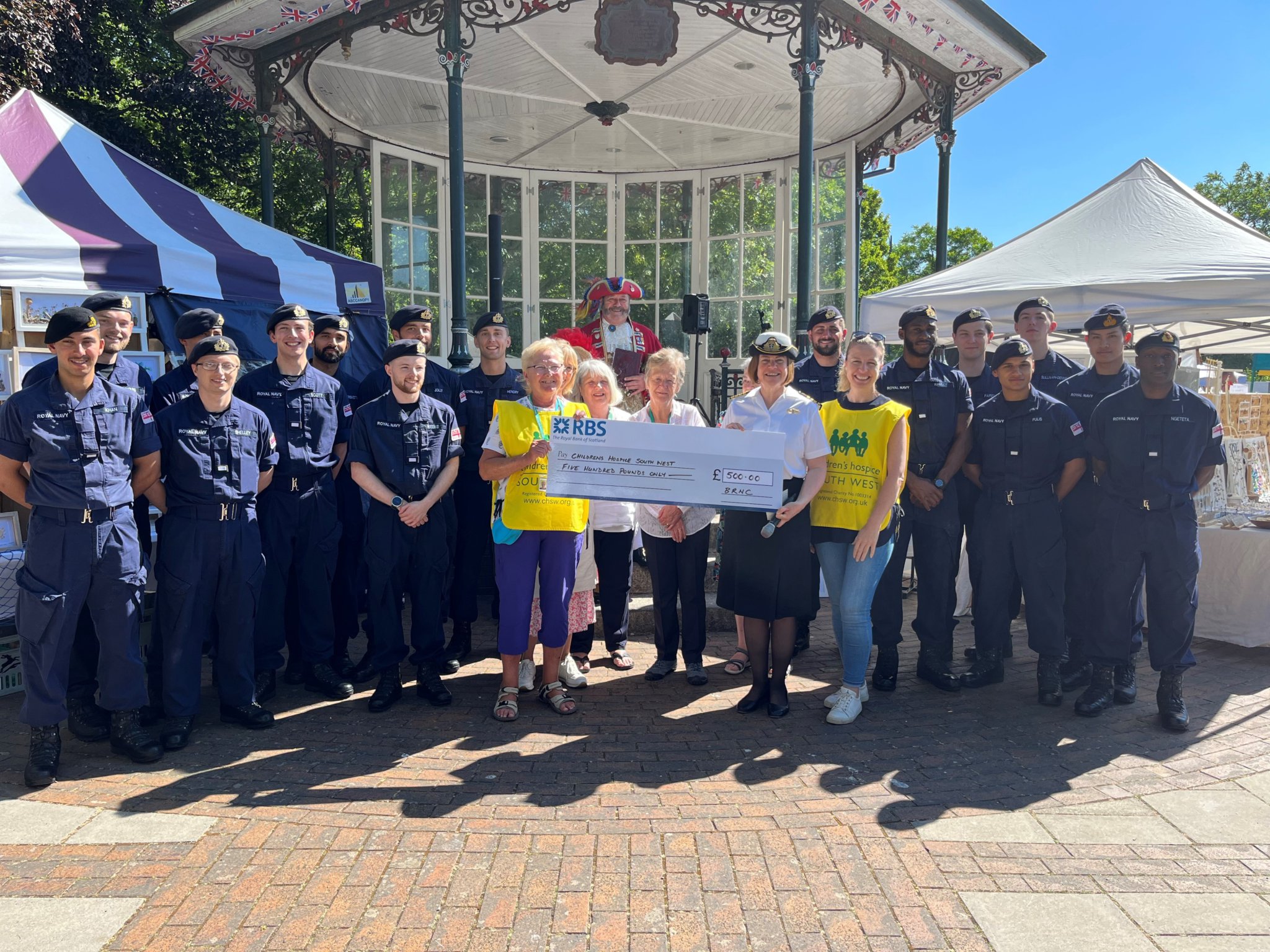 BRNC’s Captain Sarah Oakley presents a cheque for £500 to the children’s hospice.