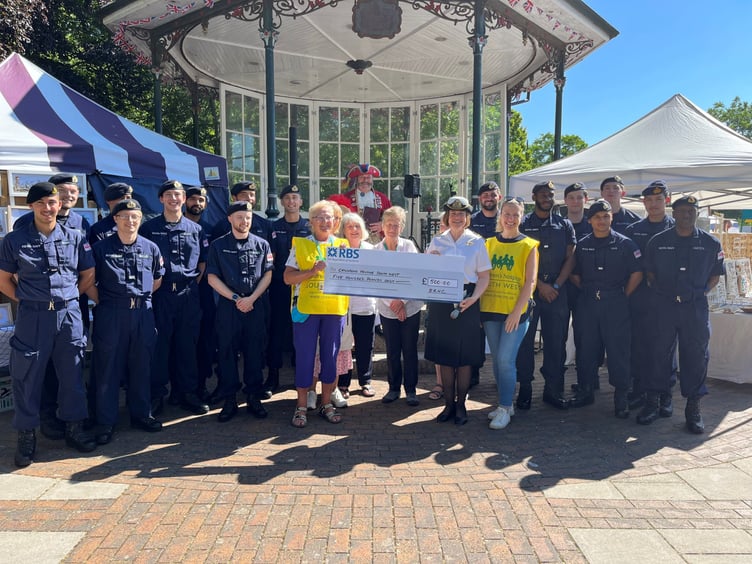 BRNC’s Captain Sarah Oakley presents a cheque for £500 to the children’s hospice.