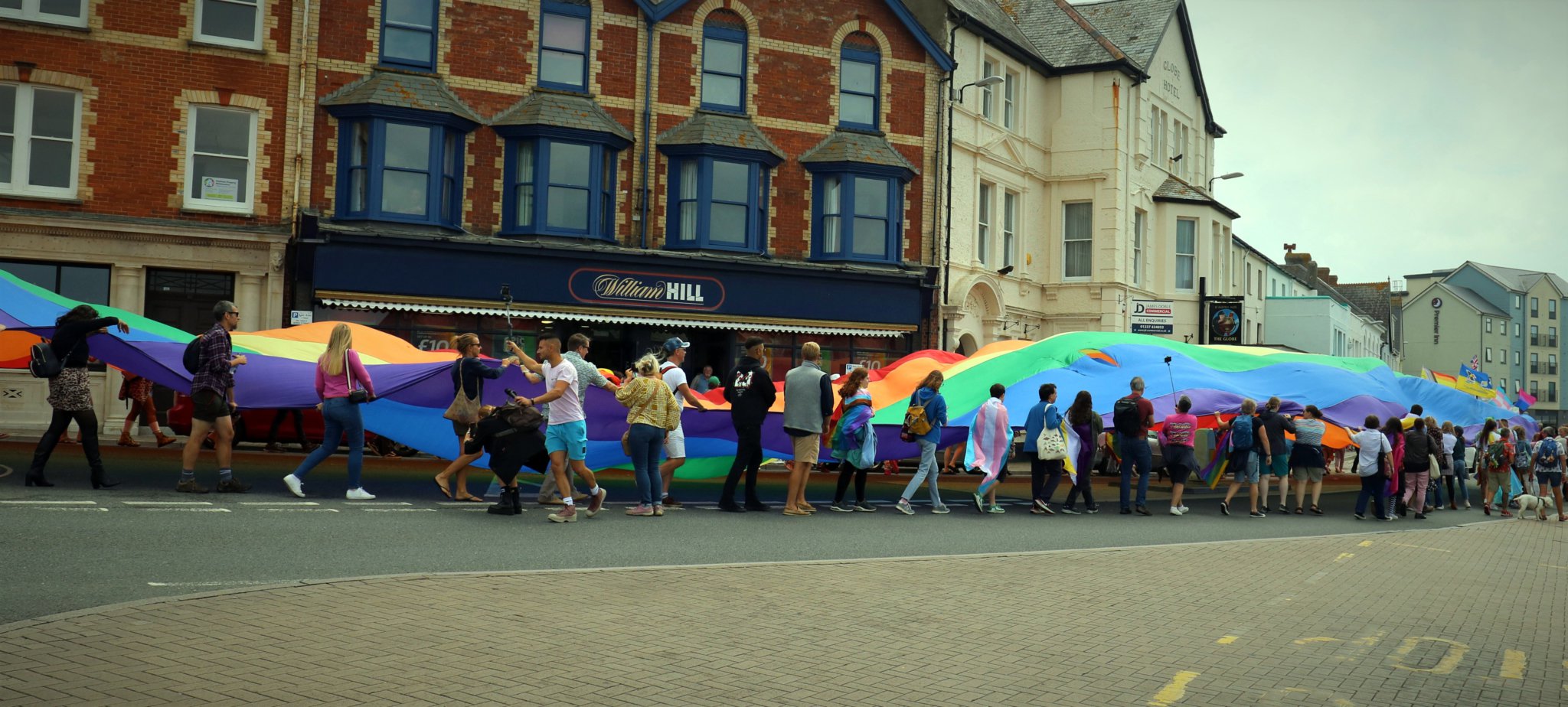 A large rainbow flag was carried through town. Pictures: Ryan Ives