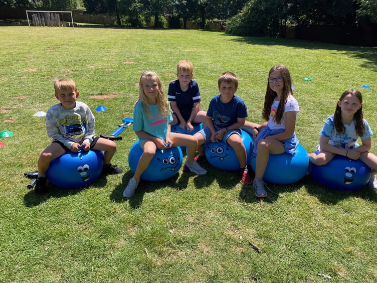 Some of the children from Landscore Primary School who took part in a sponsored bounce to raise funds for a new decking area. NP 070723 01