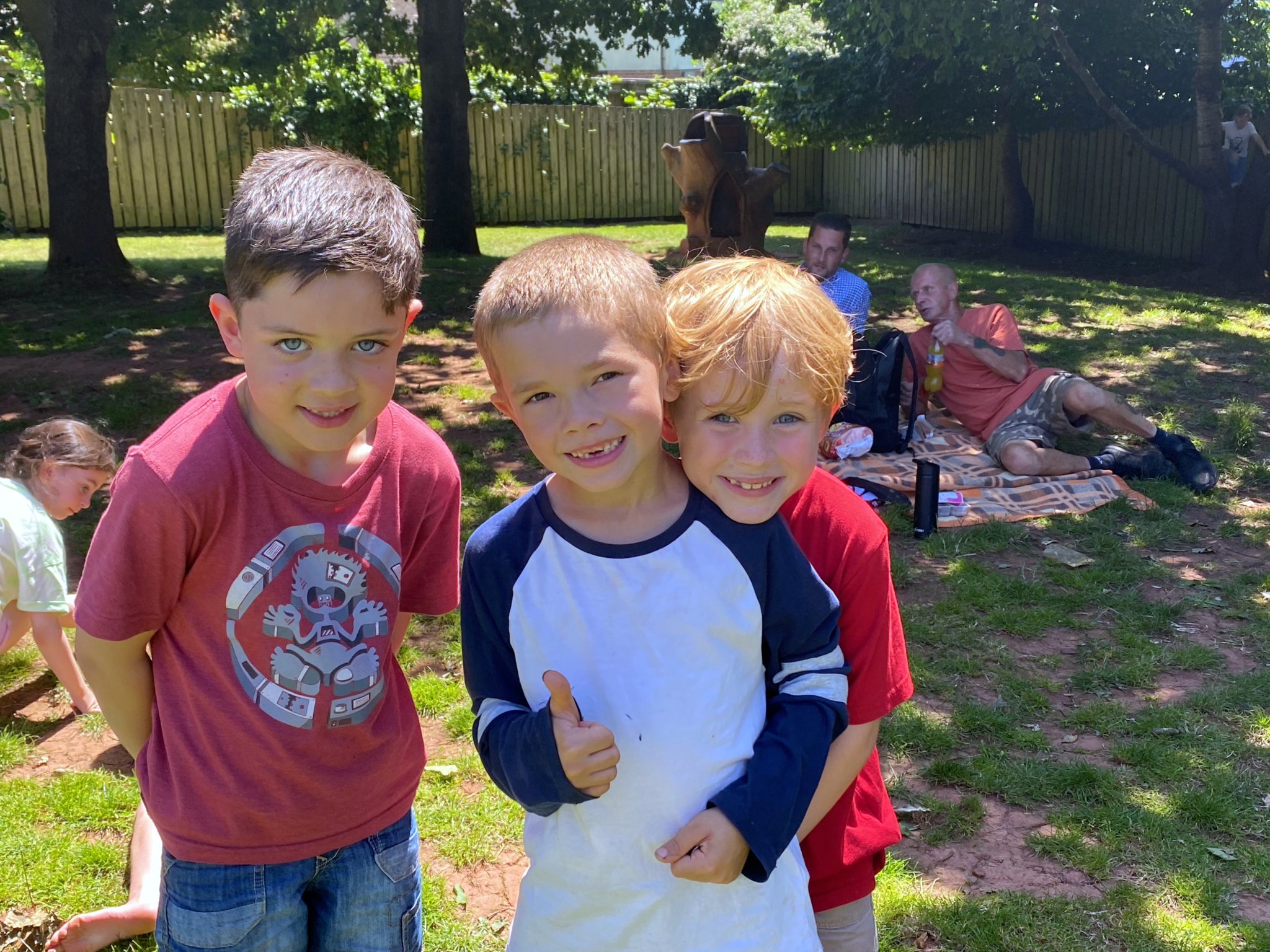 Three friends, Harrison, Archie and Arthur enjoying the school picnic. NP 070723 03