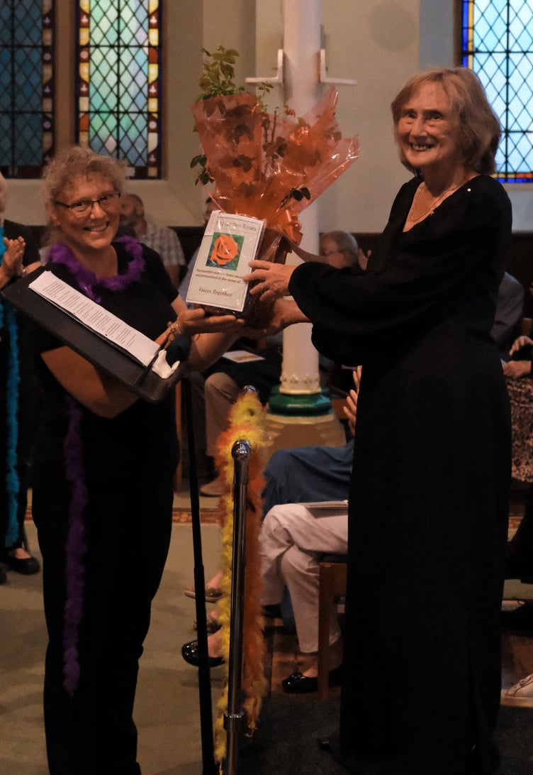 Valerie Hoppé is presented with a Voices Together rose, Spire Church, Farnham, July 1st 2023.