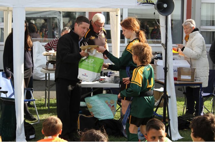 Iwan Evans, Toyota Harlech, presenting T shirts and certificates