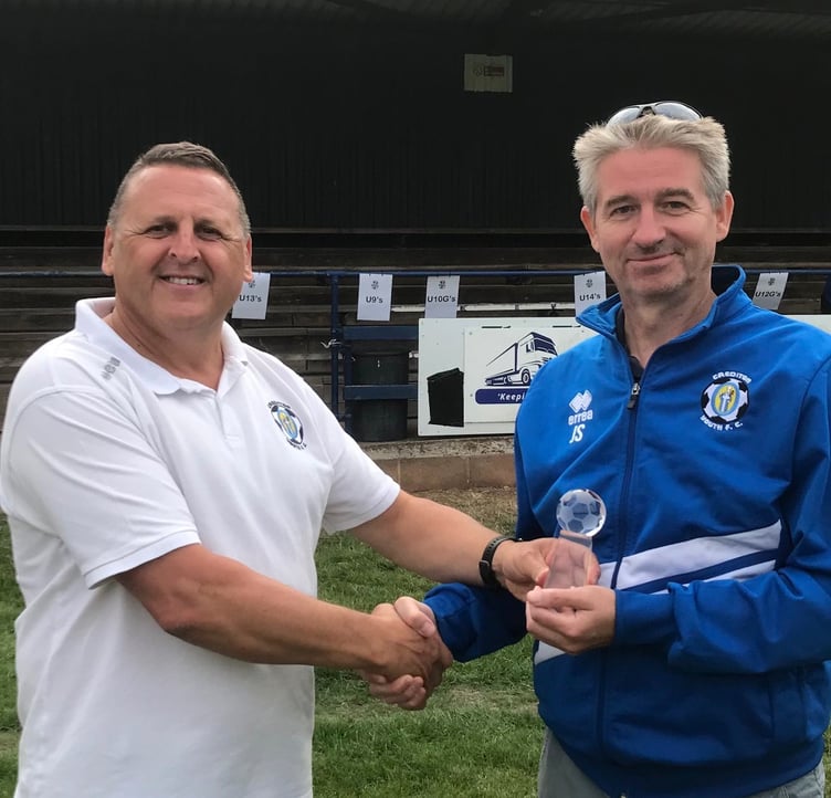 Adrian Harvey presenting the Chairman’s award to Jim Southall.