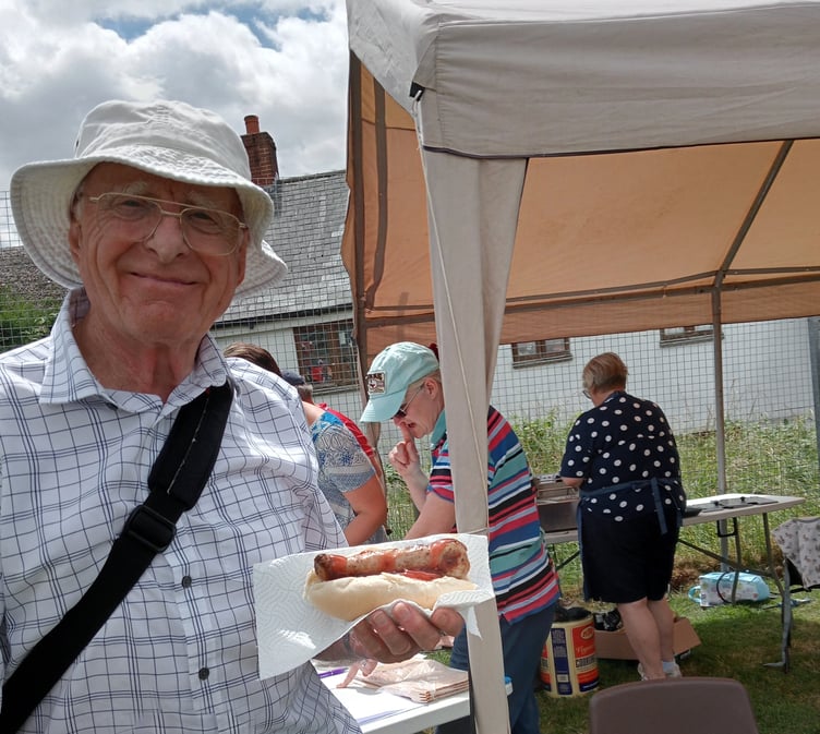 Eating his hot dog is Cyril Chudley, of Crediton.