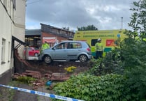 Man taken to hospital after car crashes into wall at Crediton flats