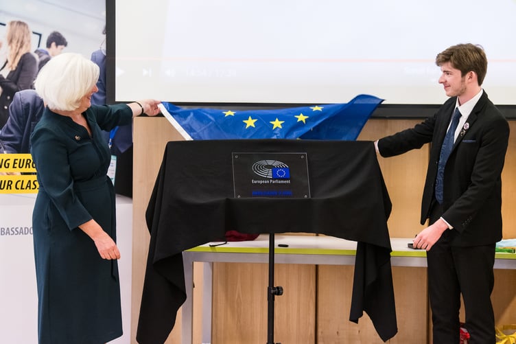 Former MEP Caroline Voaden and Queen Elizabeth's School ambassador Theo Whish unveil the honorary plaque on July 14.
