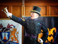 Haslemere Town Crier rings championship bell