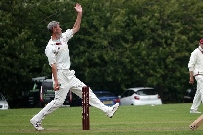 Clanfield opening bowler Nick Sawyer in his delivery stride