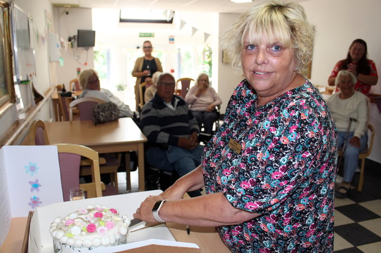 Sharon cutting her cake. SR 8285