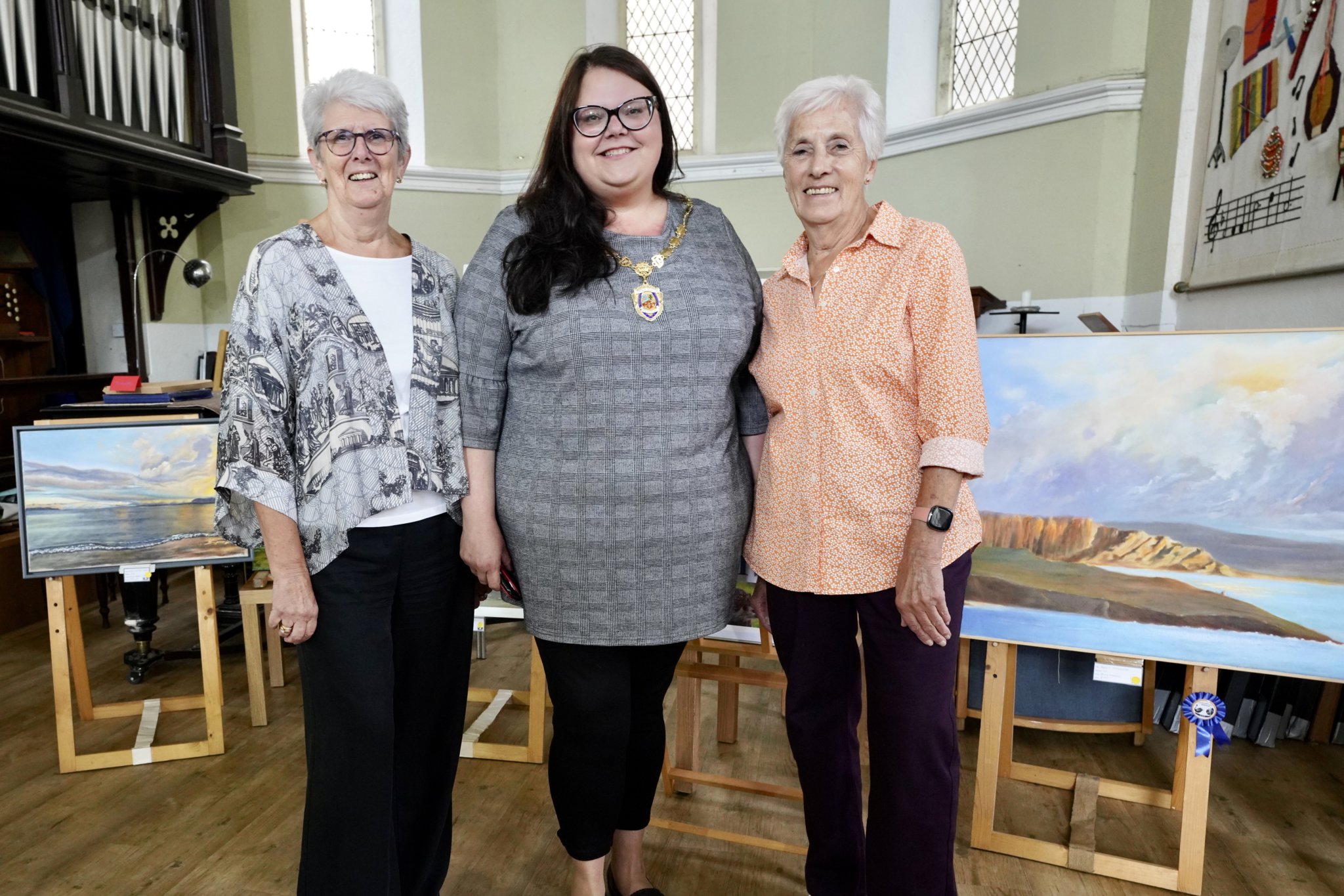 Joan Cato, chairman, Mayor of Dawlish Rosie Dawson and Jenny Norman, retiring chairman now president at the Strand Centre