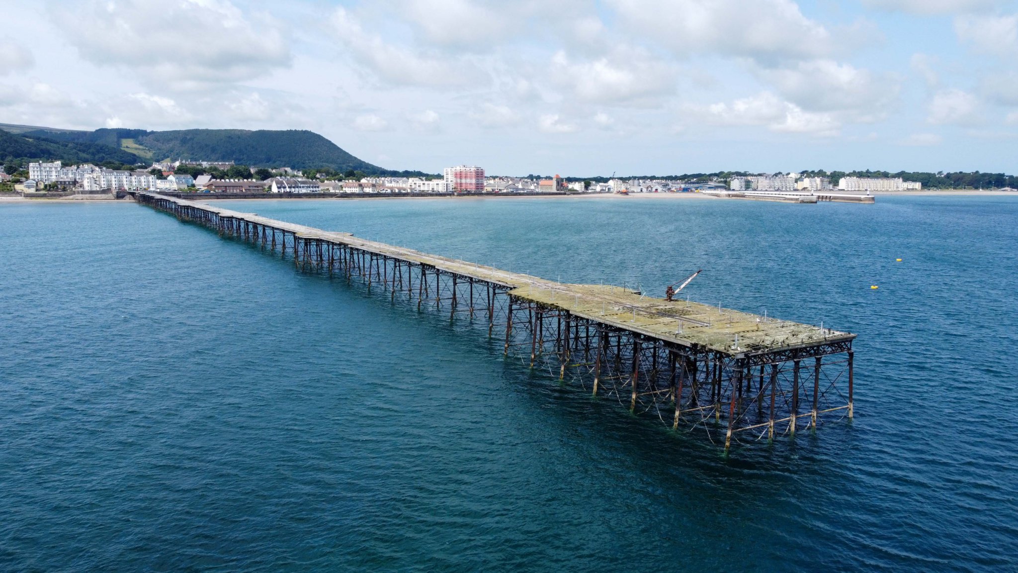 The restoration of the Queen’s Pier in Ramsey is subject of a new film. Inset, a question and answer session at a screening of the film at the Erin Arts Centre last week