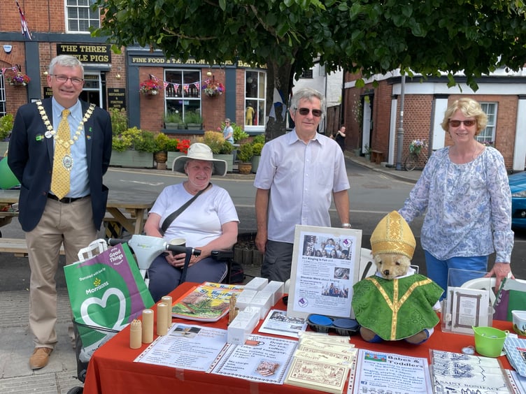 Cllr Ian Hall beside the Crediton Parish Church stall at last year’s Festival. AQ 1110
