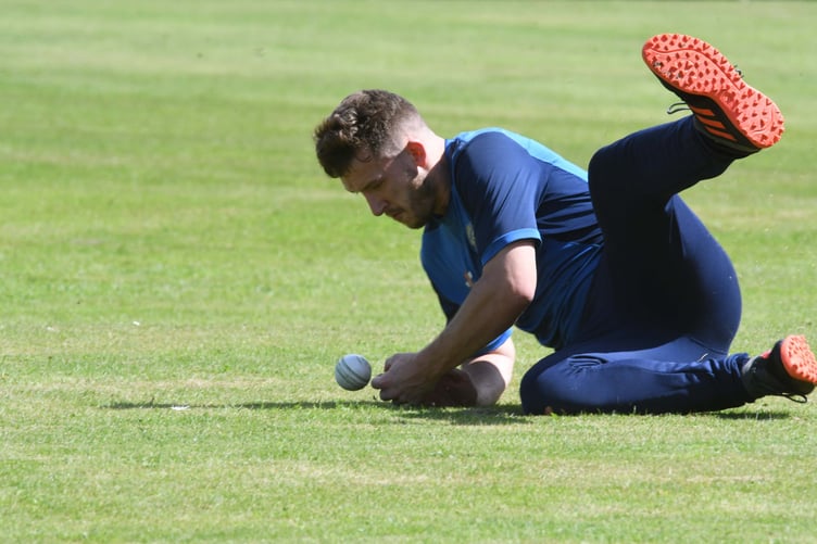 Peel and St John’s player Kieran Cawte fields the ball against Cronkbourne. He caught out Hari Radhakrishnan (DK230729 (8))