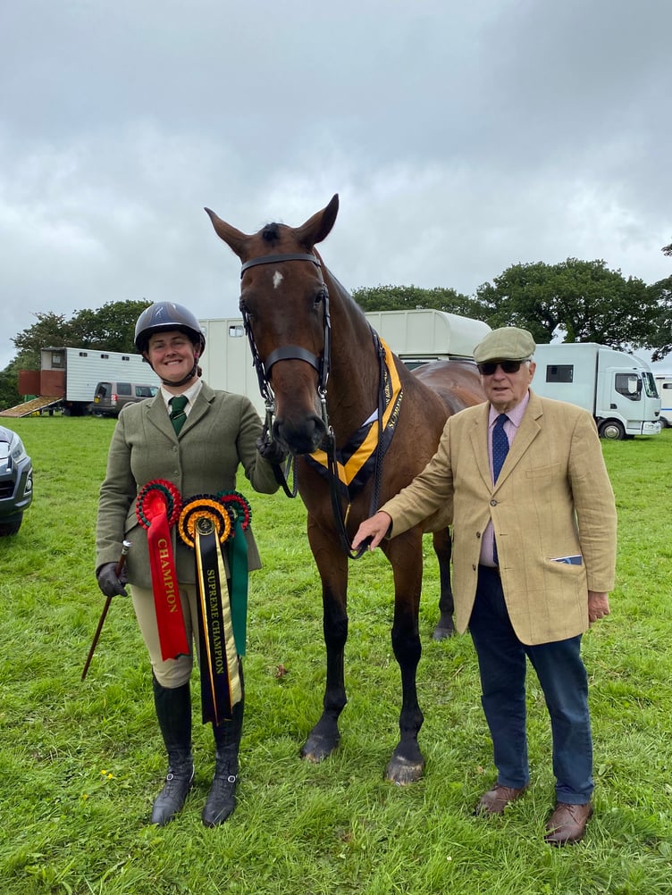 Lizzie Luxton from Lifton is pictured here with the overall supreme ridden horse of the show, Mounts Bay or ‘Robbie’. Also pictured is Trevor Burley from Truro who is Robbie’s owner. Lizzie said: “We are delighted, over the moon, he really deserved it.”