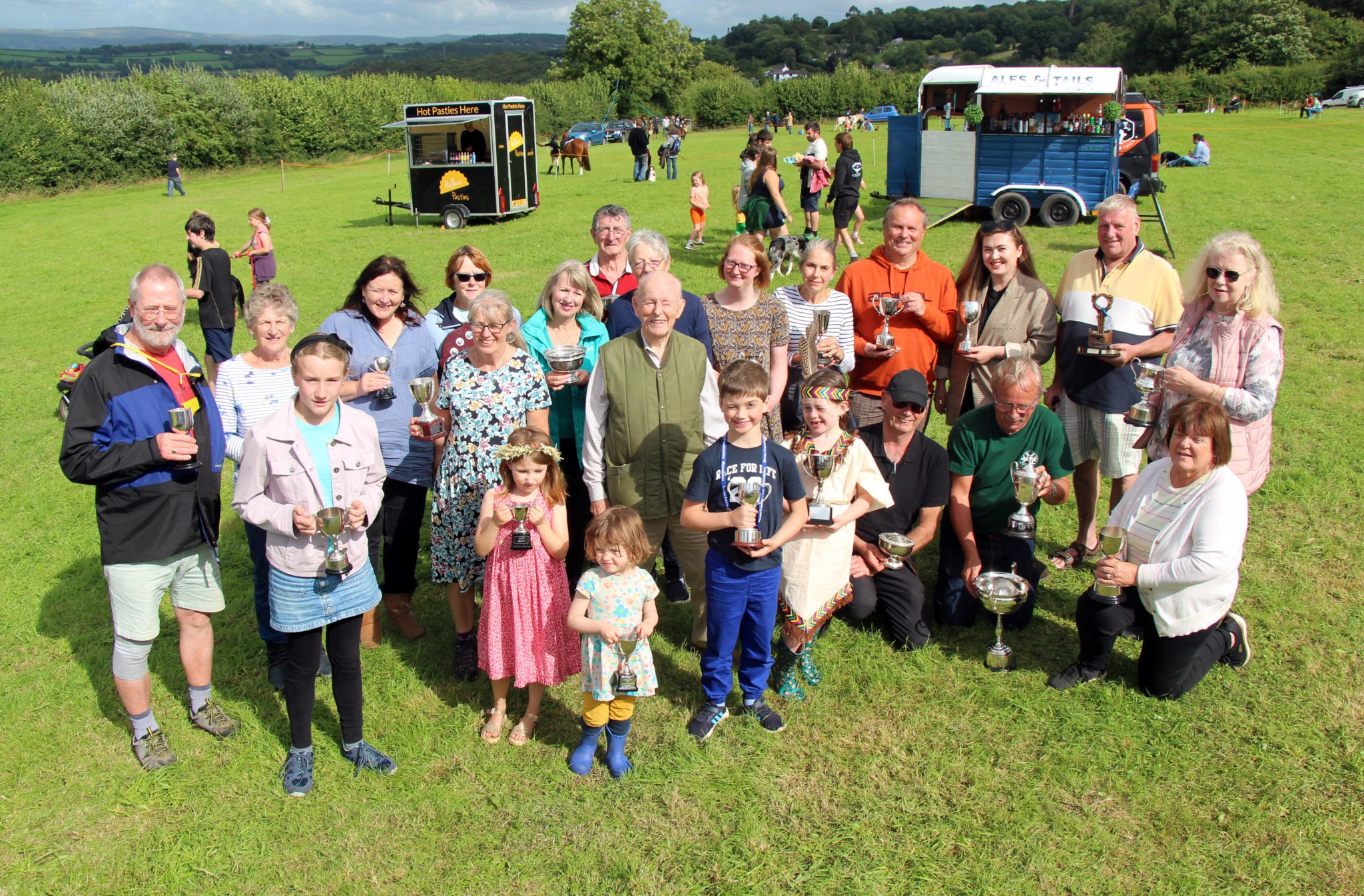 The winners at this year’s Latchley, Chilsworthy, and Cox Park Show proudly display their trophies