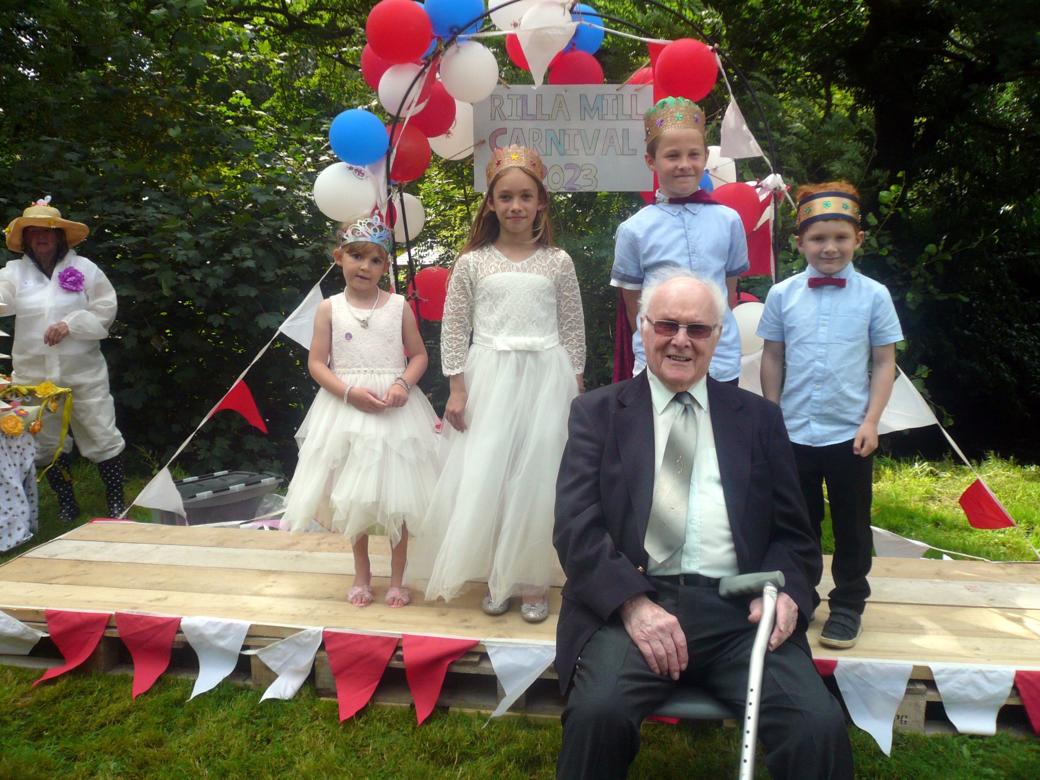 Mr Jack Davy, Honorary Member of Rilla Mill Village Hall and past chairman with the carnival royalty Queen Natalie, King Bobby with attendants Merryn and Harry Davy