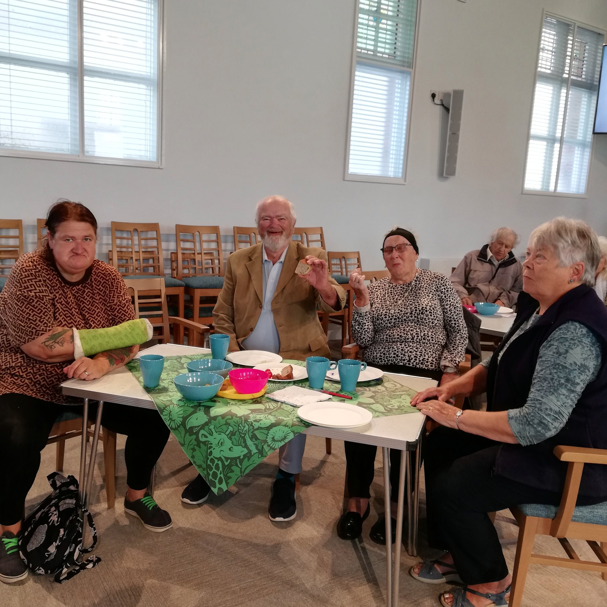 Some members of the congregation enjoying a picnic at the Café Church service at Crediton Methodist Church.