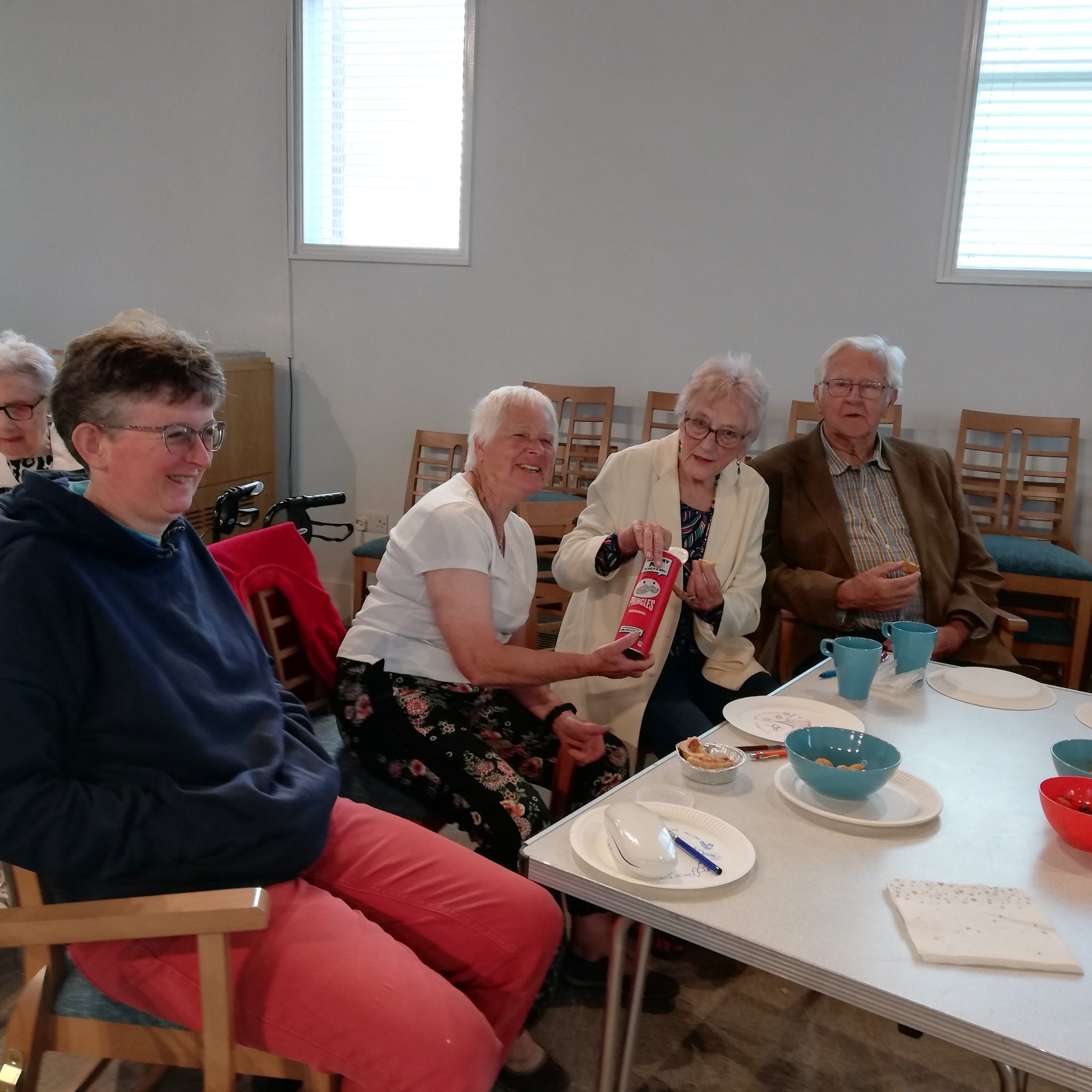 Some members of the congregation enjoying a picnic at the Café Church service at Crediton Methodist Church.