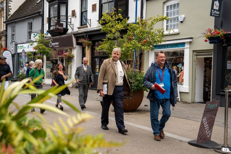 Judges walk through the town