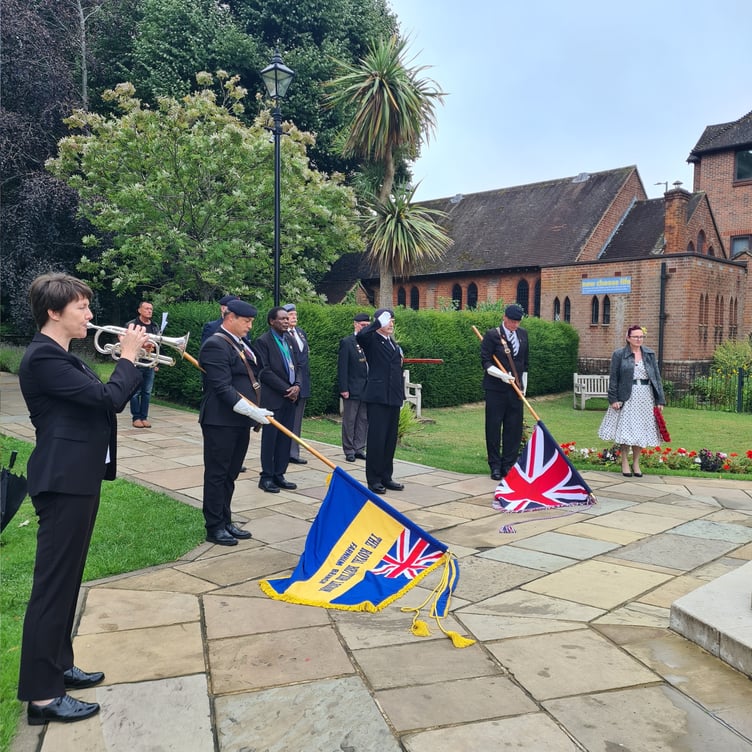 Farnham deputy mayor Brodie Mauluka looks on as the Royal British Legion standards are lowered to commemorate the 70th anniversary of the end of the Korean War at the Gostrey Meadow service on July 27