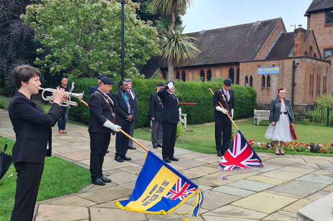 Farnham deputy mayor Brodie Mauluka looks on as the Royal British Legion standards are lowered to commemorate the 70th anniversary of the end of the Korean War at the Gostrey Meadow service on July 27