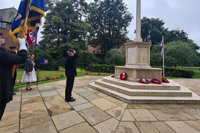 A member of the Royal British Legion salutes at the Gostrey Meadow war memorial on July 27 to commemorate the 70th anniversary of the end of the Korean War