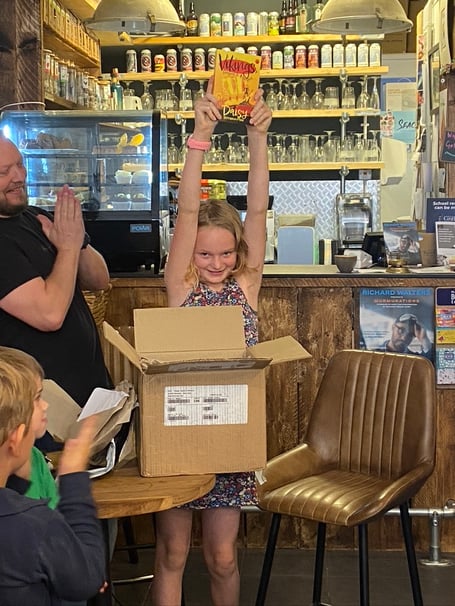 Daisy Shrimpton-Mace, 9, from Alton, holds her novel aloft at the Goldfinch Books launch