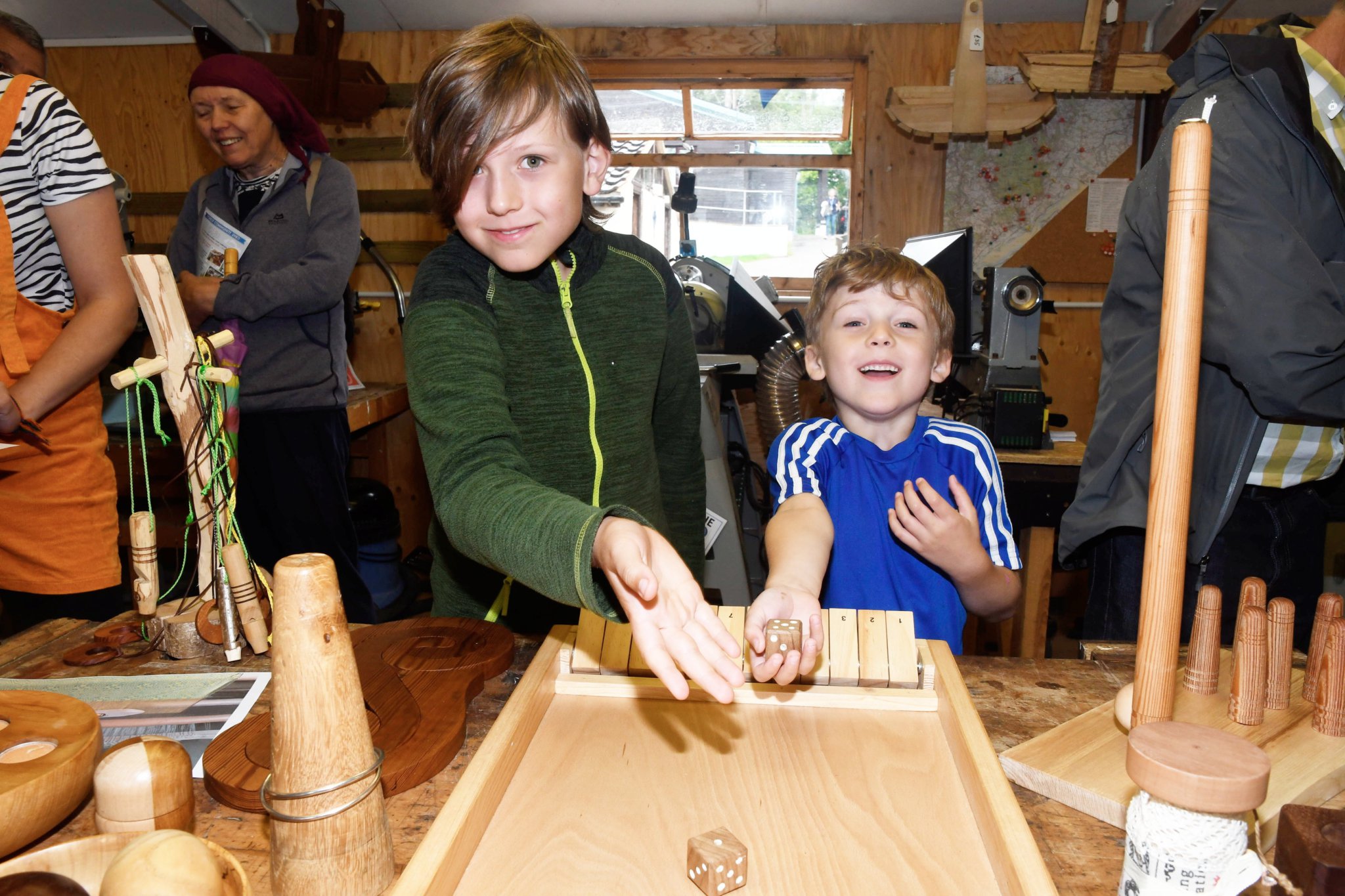 n Alex and Charlie Bell try out a dice game.