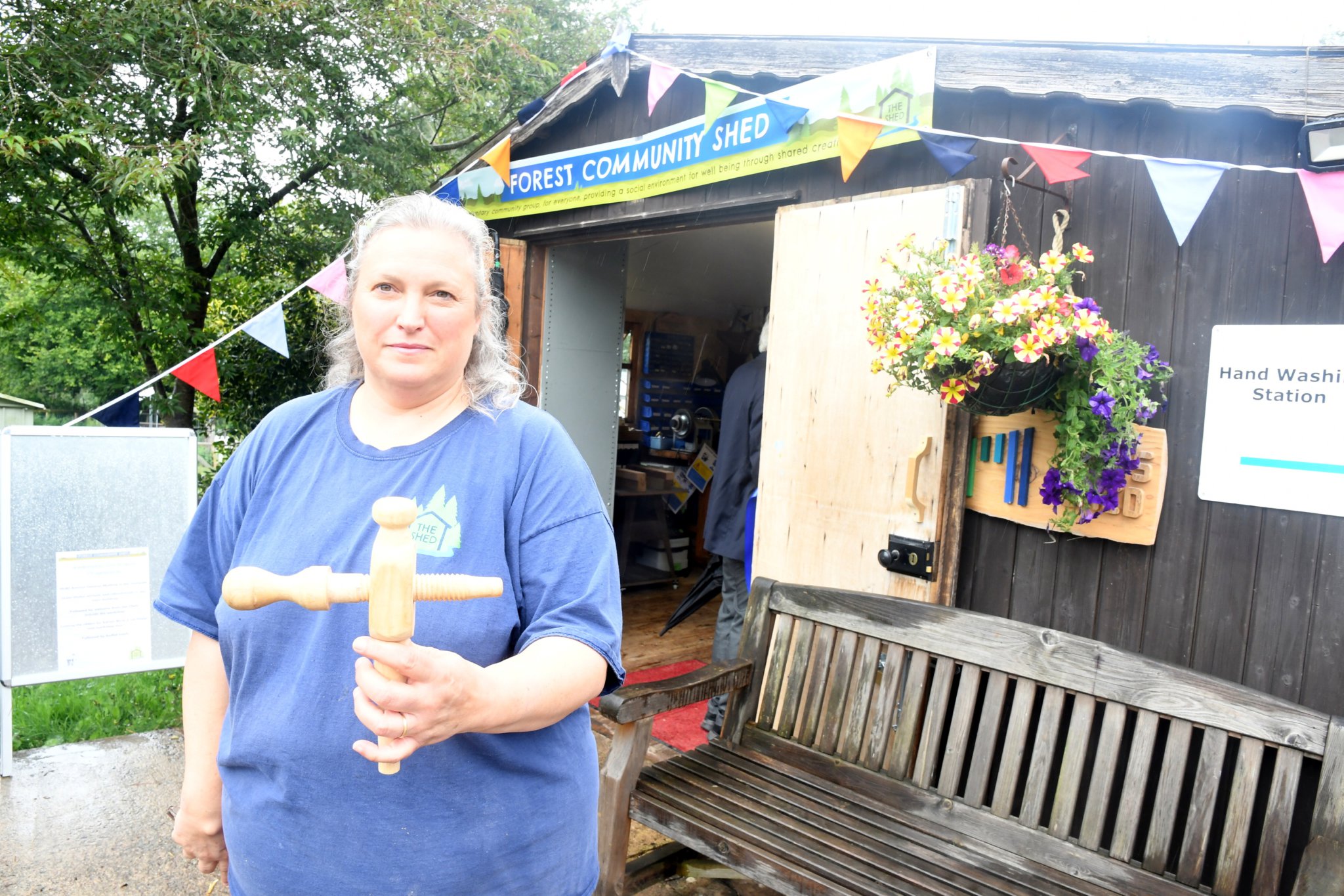 n Debbie Landsbert with the "tensioner" she made for her spinning wheel and (inset) Debbie using the wheel at a medieval re-enactment event.
