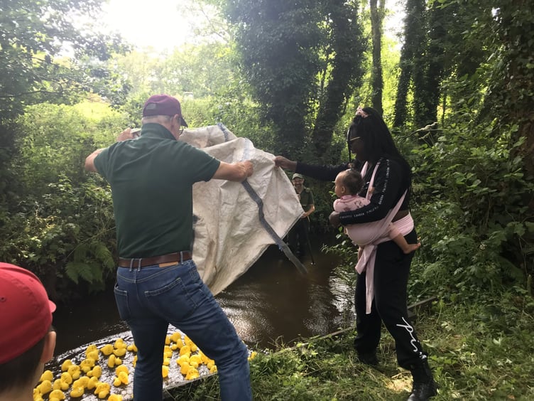 Starting race two of the Deadwater Valley Duck Race is Councillor Bisi Kennard and DVT trustee Stefan Mitchell