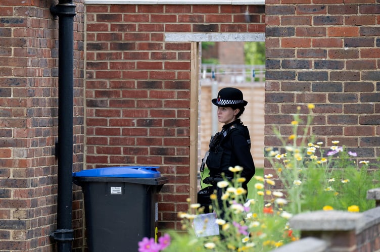 Police outside an address on Hammond Road, Woking, August 10, 2023