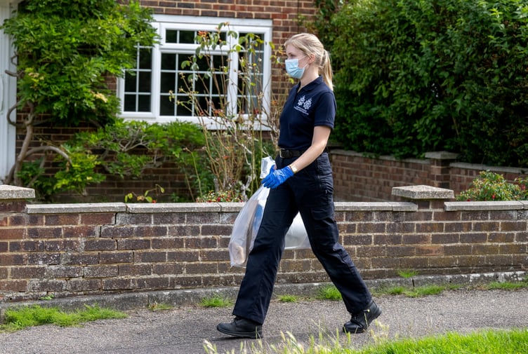 Police outside an address on Hammond Road, Woking, August 10, 2023