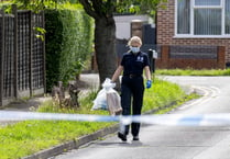 Police forensics officers remove evidence from Horsell murder scene