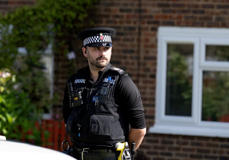Police outside an address on Hammond Road, Woking, August 10, 2023