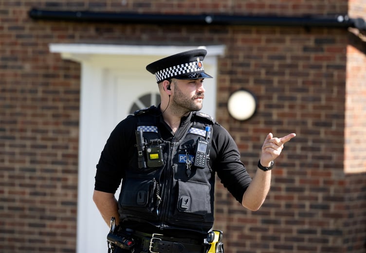 Police outside an address on Hammond Road, Woking, August 10, 2023