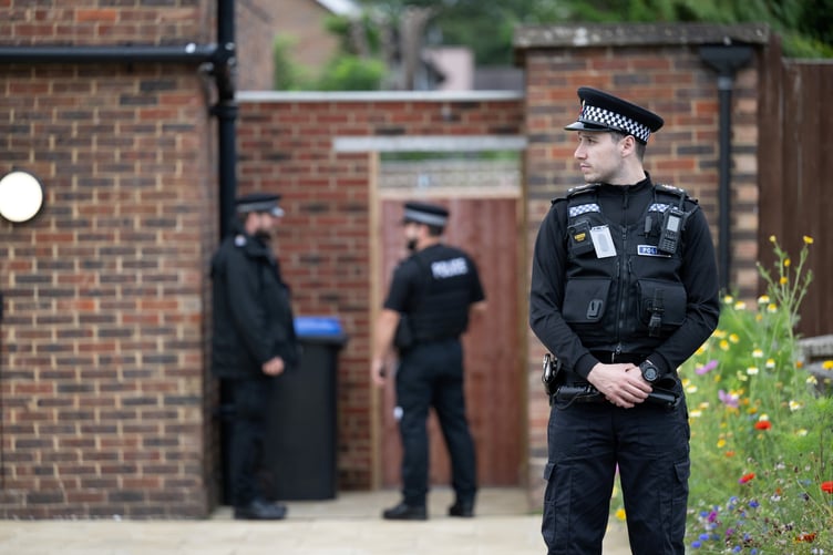 Police outside an address on Hammond Road, Woking, August 10, 2023