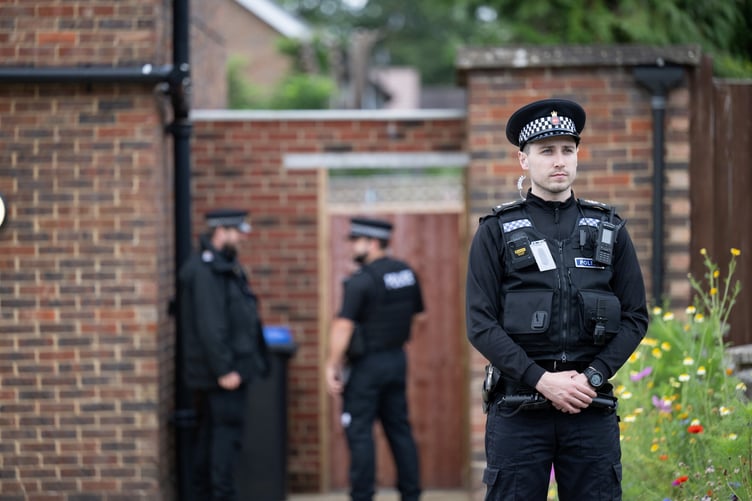 Police outside an address on Hammond Road, Woking, August 10, 2023