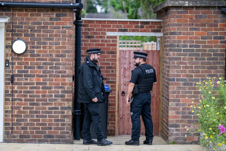 Police outside an address on Hammond Road, Woking, August 10, 2023