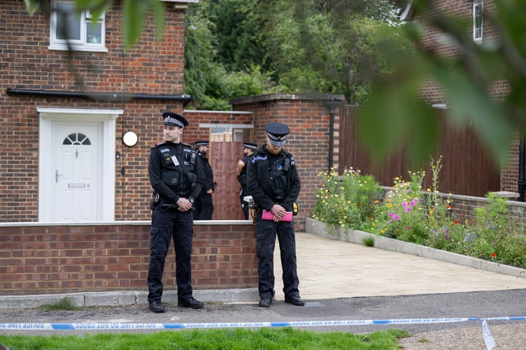 Police outside an address on Hammond Road, Woking, August 10, 2023