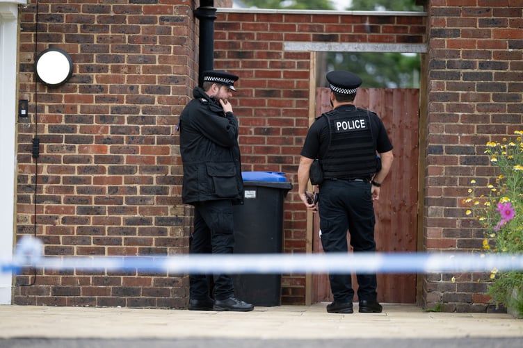 Police outside an address on Hammond Road, Woking, August 10, 2023