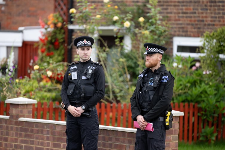 Police outside an address on Hammond Road, Woking, August 10, 2023