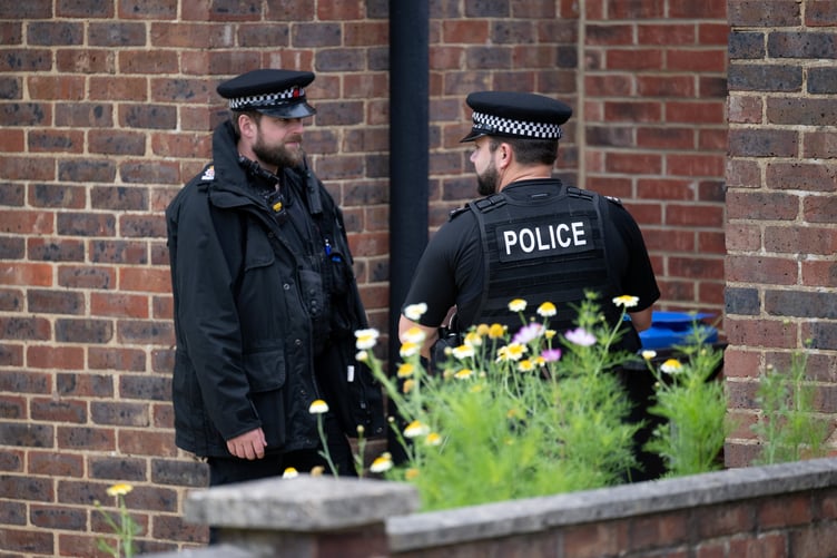 Police outside an address on Hammond Road, Woking, August 10, 2023