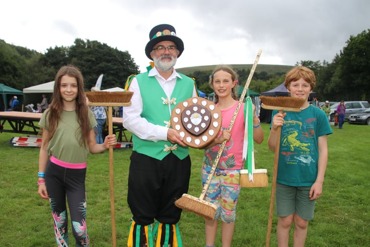 David Minty, Squire Elect, Exeter Morris, presented Dorothy Parker-Groom (11), with the award for winning the Dartmoor Broom Dance Championship, pictured with the runners-up.
