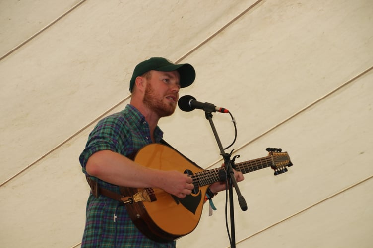 Jack Rutter singing atop the wagon in the main marquee.