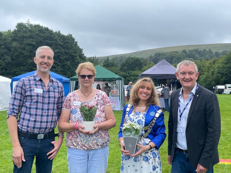 Alan Quick, right, officially opened the Dartmoor Folk Festival, pictured with, from left, chairman Jason Rice, president Shirley Bazeley and the Mayor of West Devon, Cllr Lyn Daniels.  AQ 4223