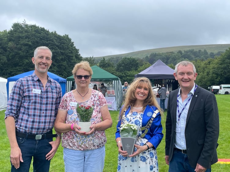 Alan Quick, right, officially opened the Dartmoor Folk Festival, pictured with, from left, chairman Jason Rice, president Shirley Bazeley and the Mayor of West Devon, Cllr Lyn Daniels.  AQ 4224
