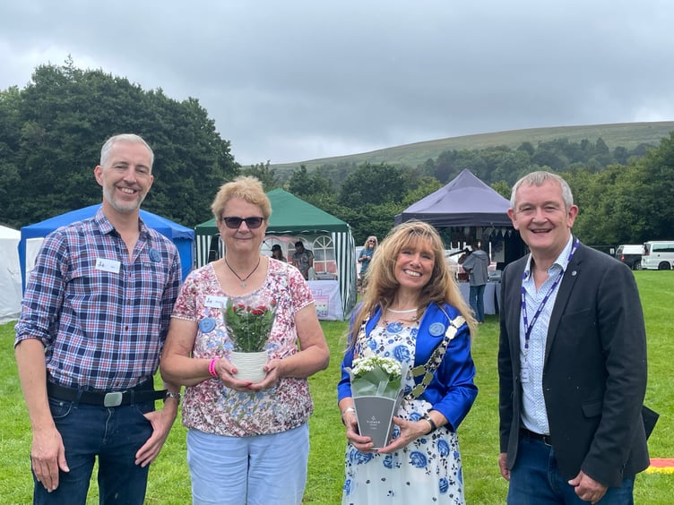 Alan Quick, right, officially opened the Dartmoor Folk Festival, pictured with, from left, chairman Jason Rice, president Shirley Bazeley and the Mayor of West Devon, Cllr Lyn Daniels.  AQ 4225
